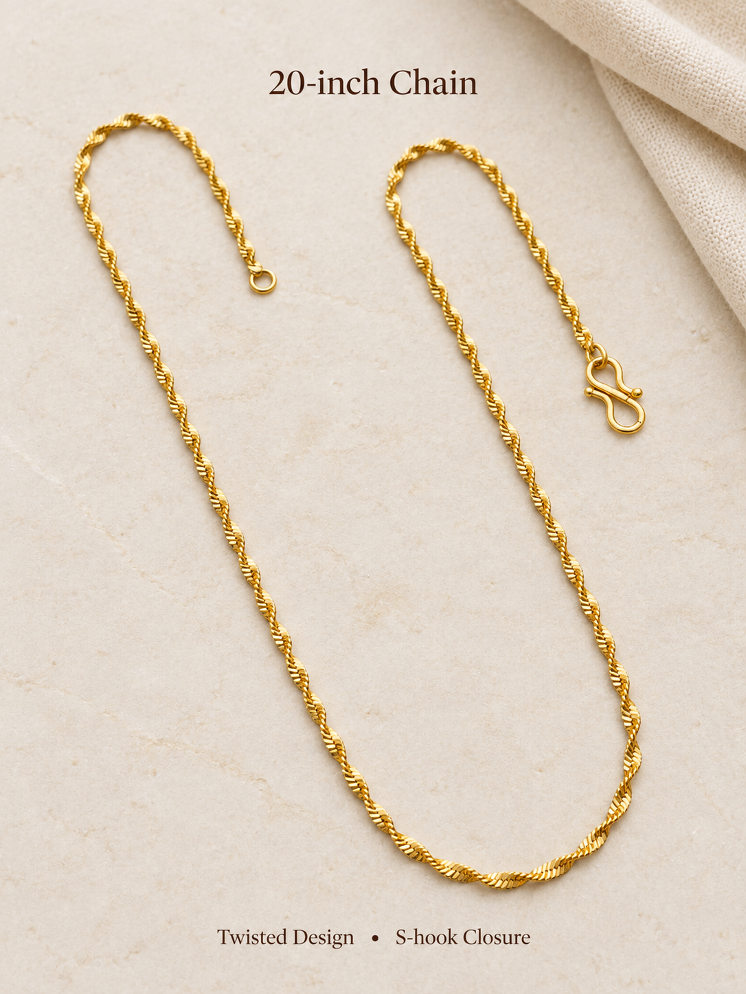 20 inch twisted gold plated chain with S-hook closure on cream background