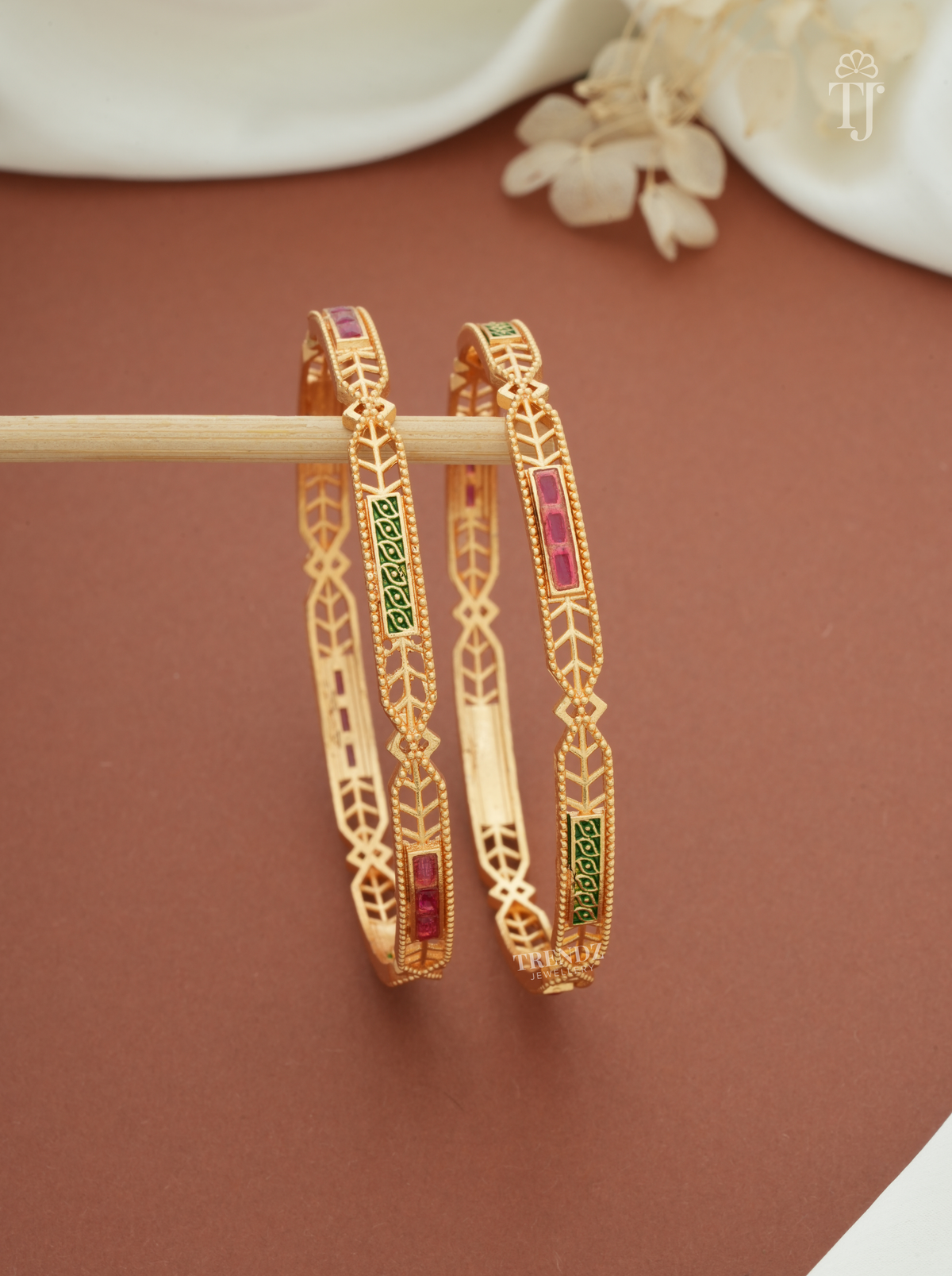 Pink green stone artificial bangles for women, gold plated brass, pair — front view