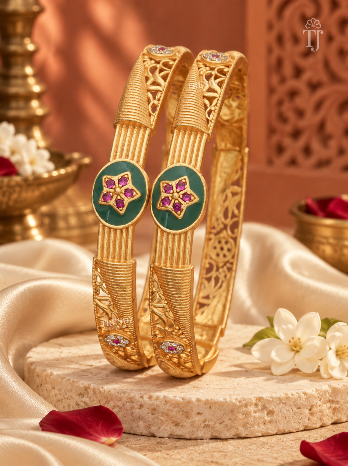 Antique gold artificial bangles with green enamel medallion styled with flowers