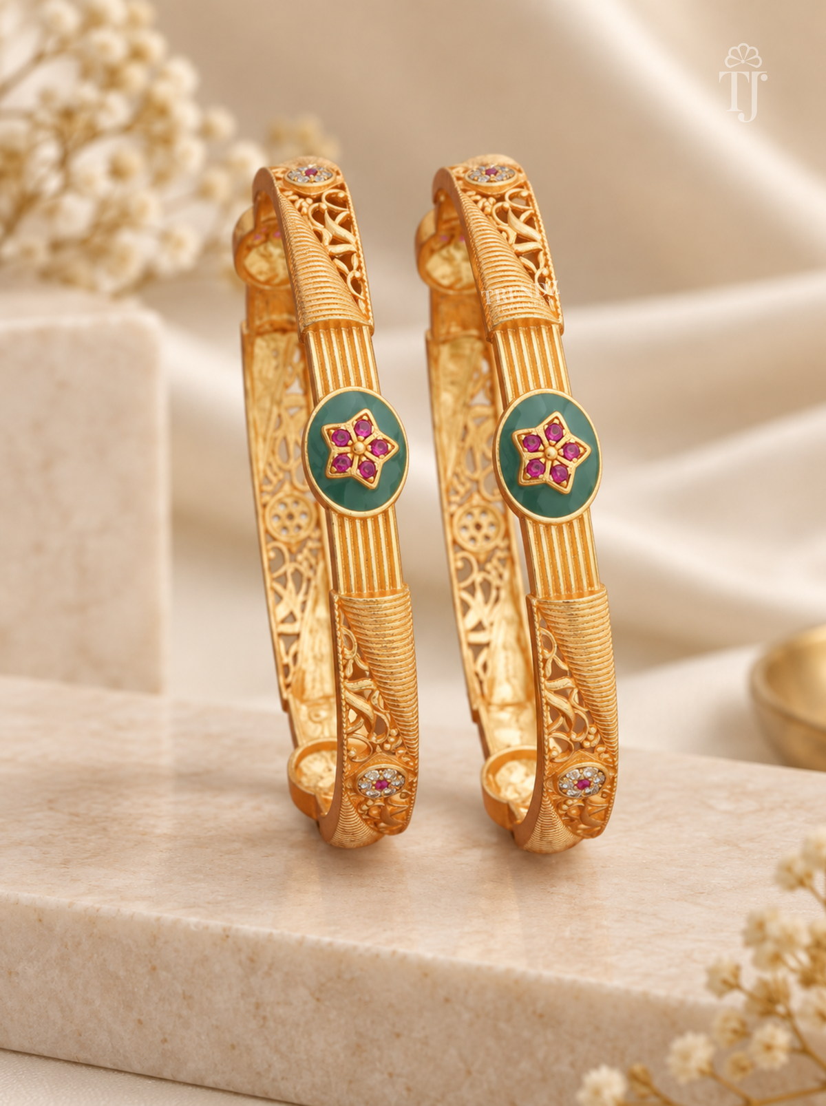 Antique finish artificial bangles with ribbed gold band and green enamel medallion — angle view