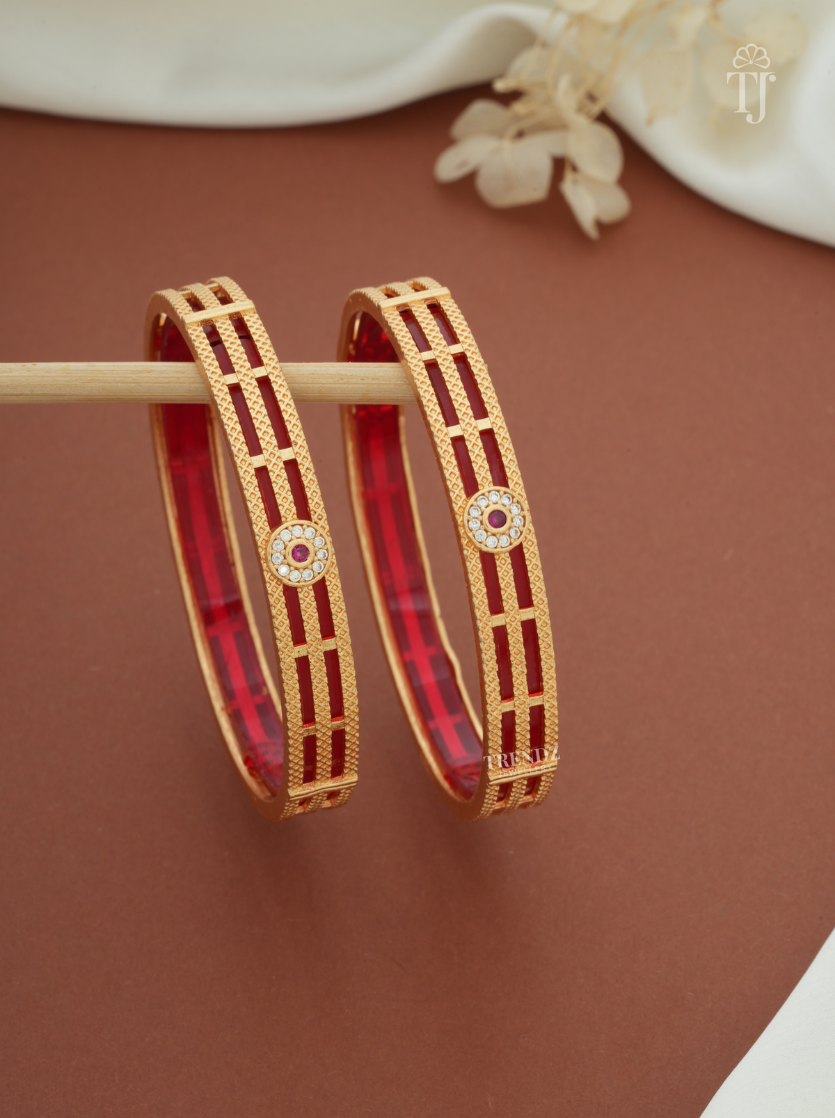 Red white stone artificial bangles for women, gold plated brass, pair — front view