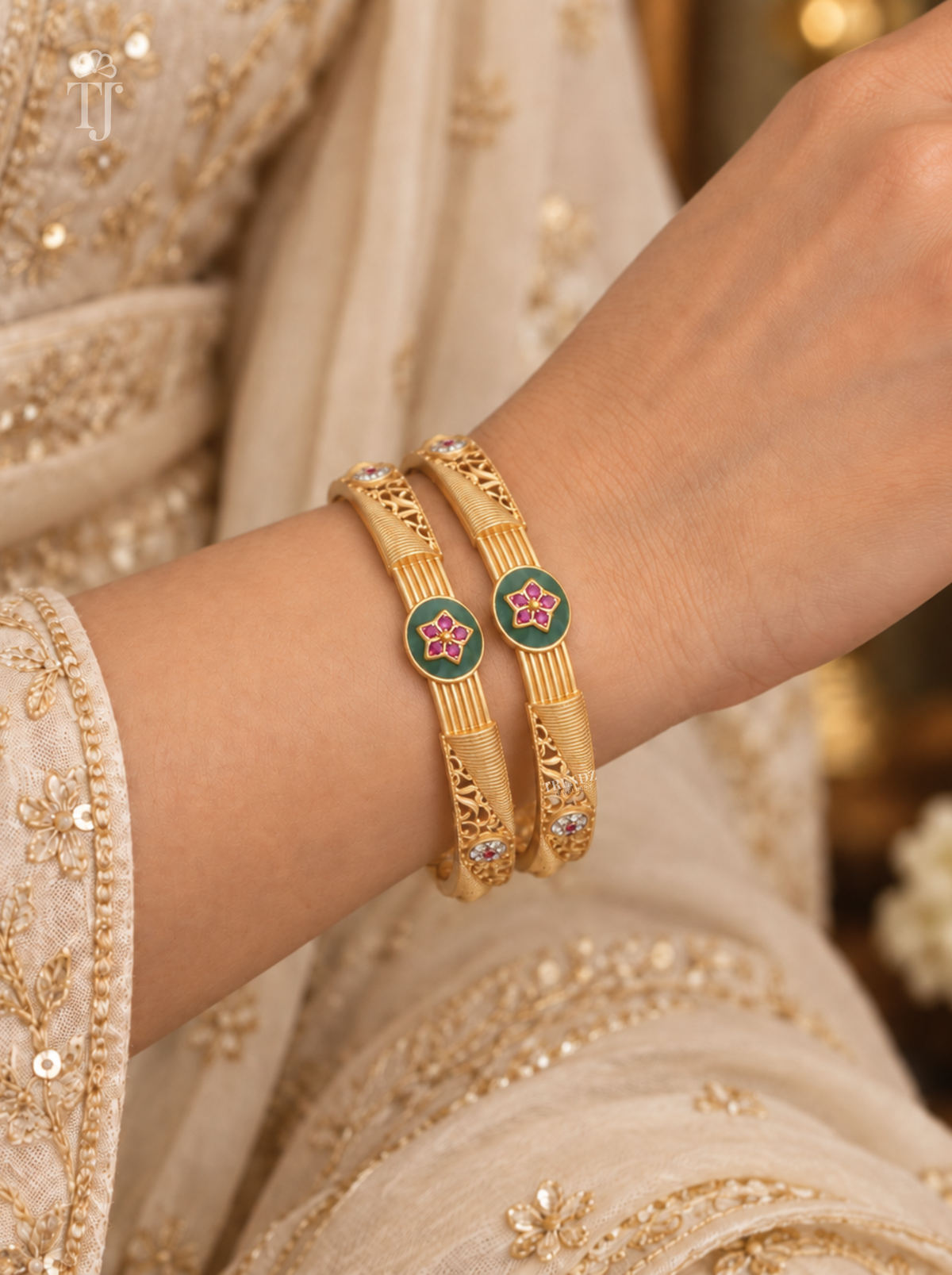 Close-up of green enamel pink star medallion worn on wrist with festive sleeve