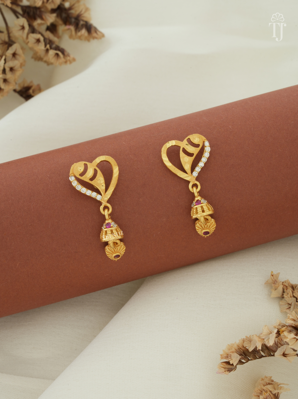 Artificial earrings for girls online, heart design AD stone top with small gold jhumka
