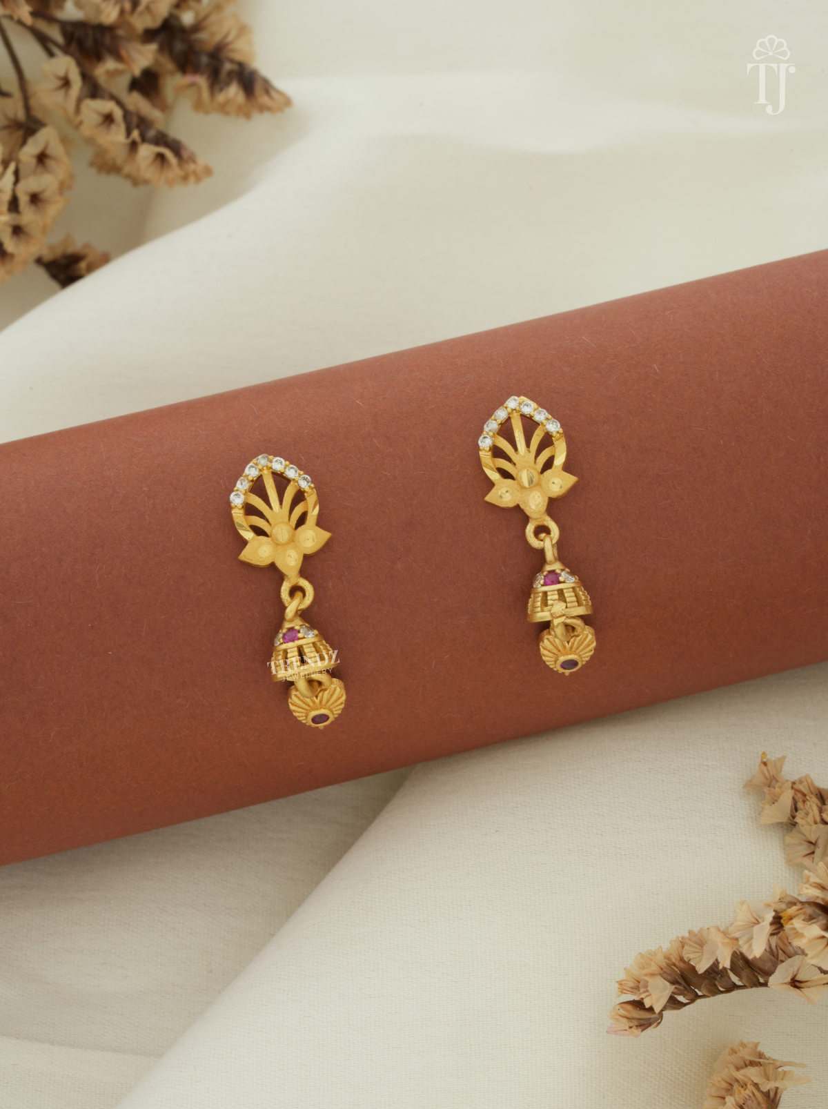 Artificial earrings for women with lotus design AD stone top and small gold jhumka
