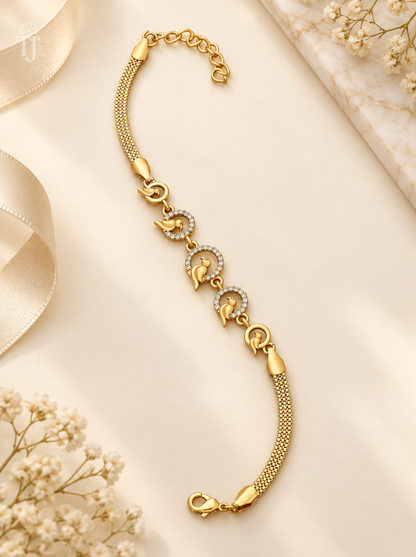 Bird design bracelet, gold plated with five round bird charms and white AD stones on cream background