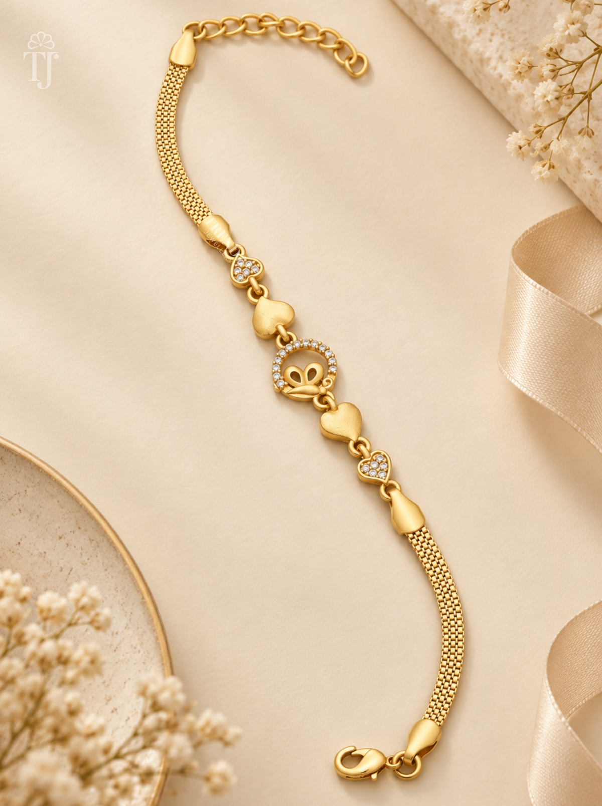 Butterfly bracelet for women, gold plated with AD stone ring, heart links and lobster clasp on cream fabric