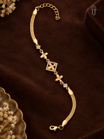 Gold plated bracelet for ladies with square flower charm and white AD stones on brown velvet