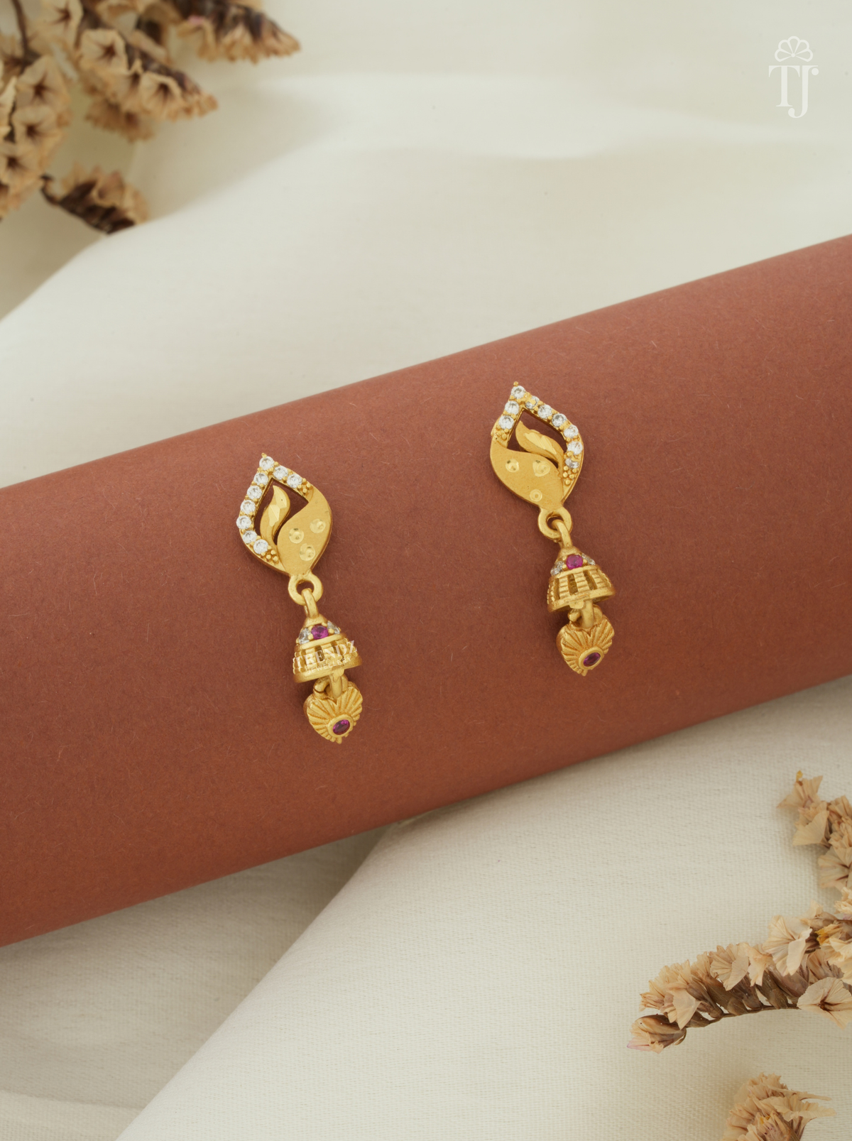 Gold plated earrings daily use with leaf design AD stone top and small jhumka drop