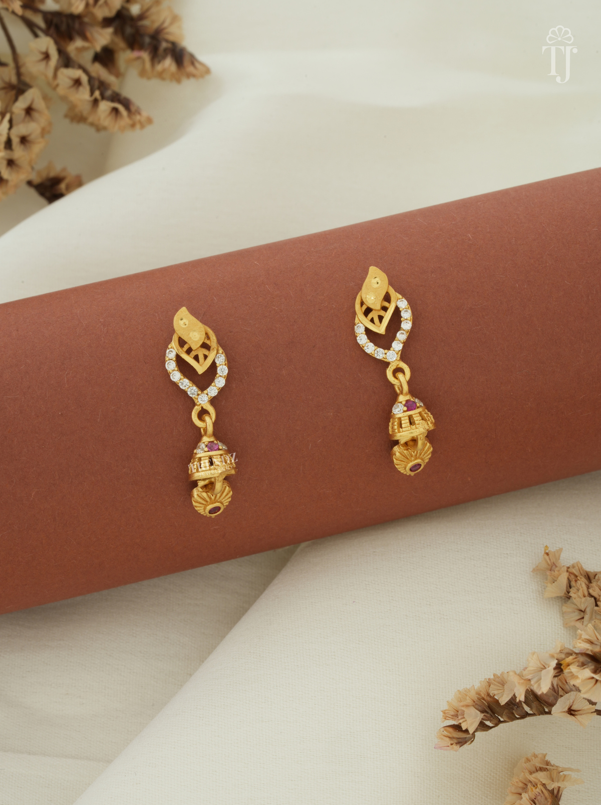 Gold plated earrings for girls with double leaf AD stone top and small jhumka drop