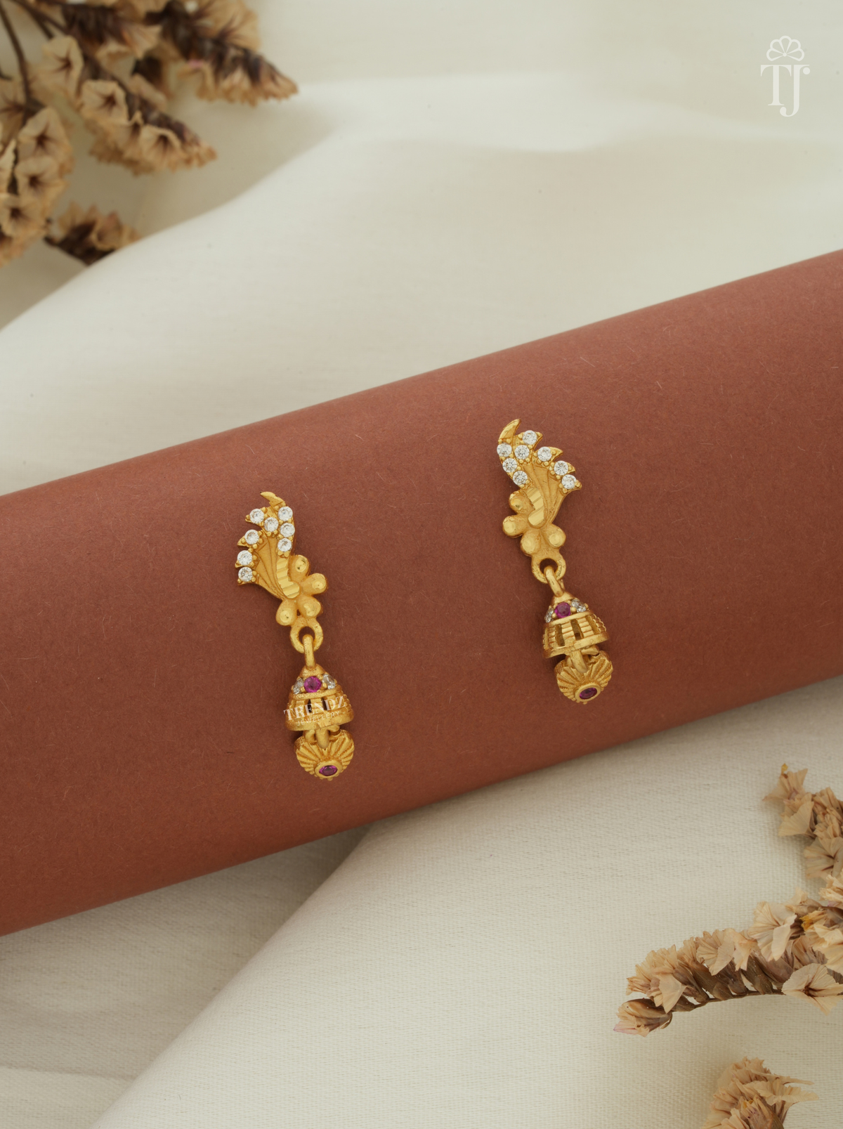 Latest earrings for girls artificial, feather design AD stone top with small gold jhumka
