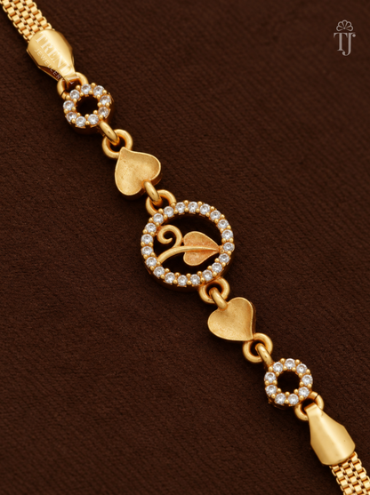Close-up of round AD stone charm with gold leaf and heart-shaped links