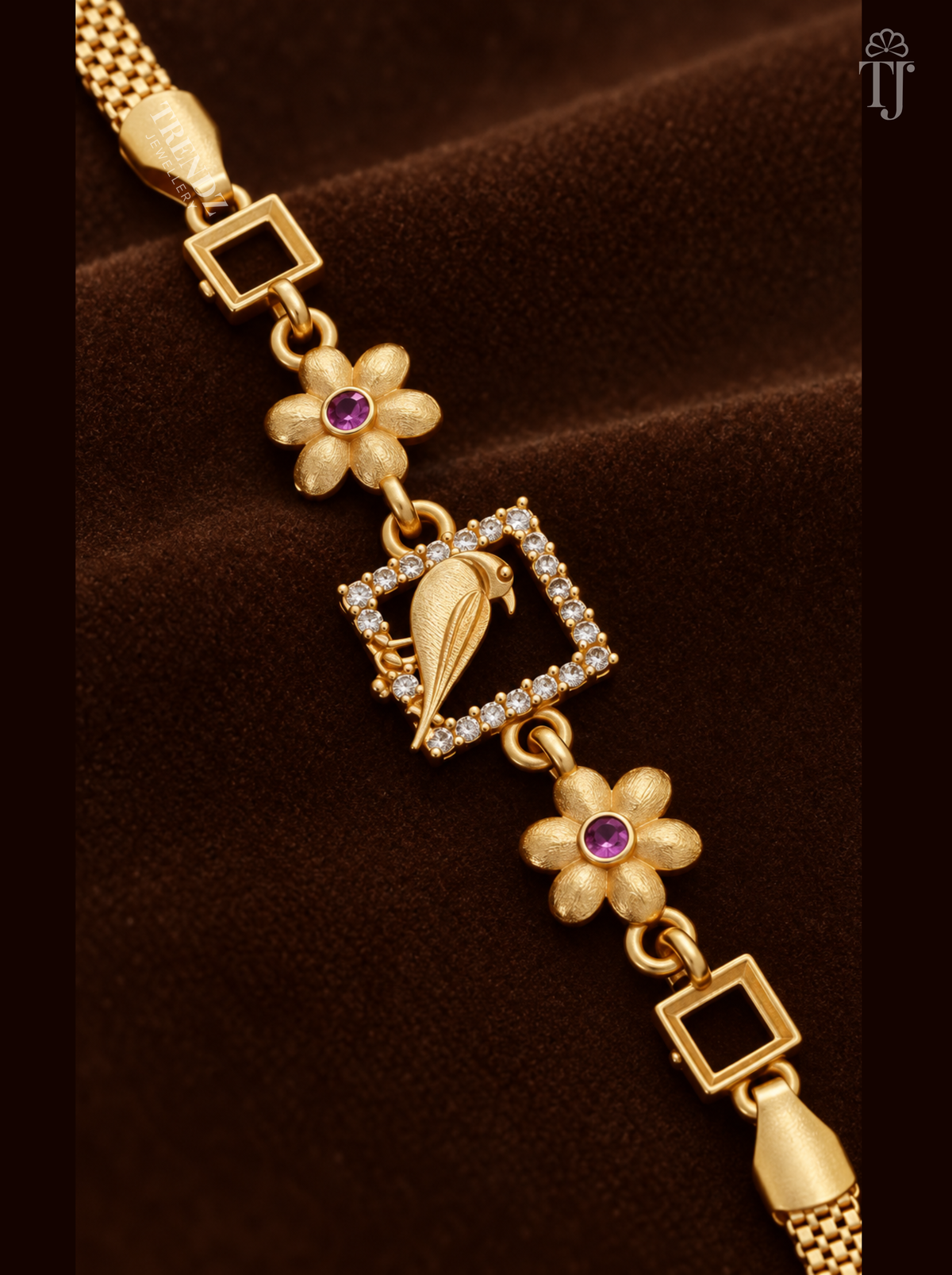 Close-up of gold parrot in white AD stone square with pink stone flower links