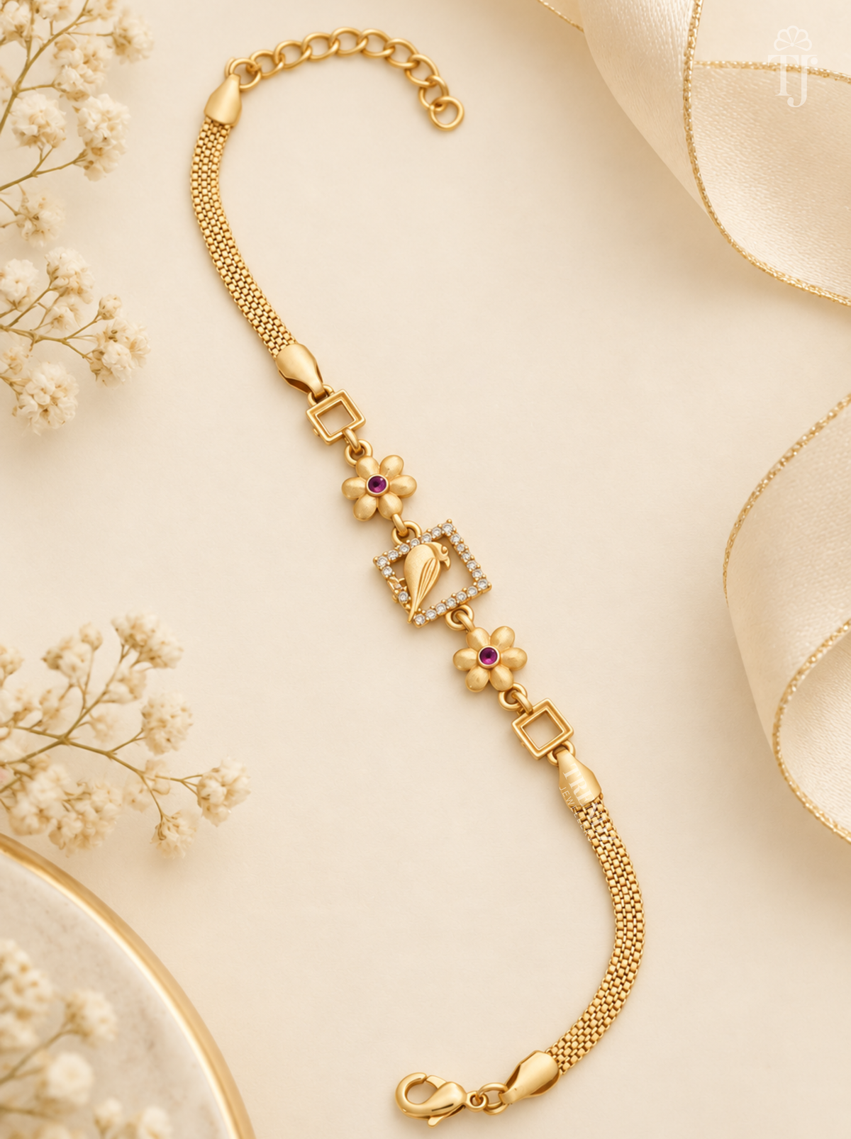 Parrot design bracelet, gold plated with AD stone square frame and pink stone flowers on cream background