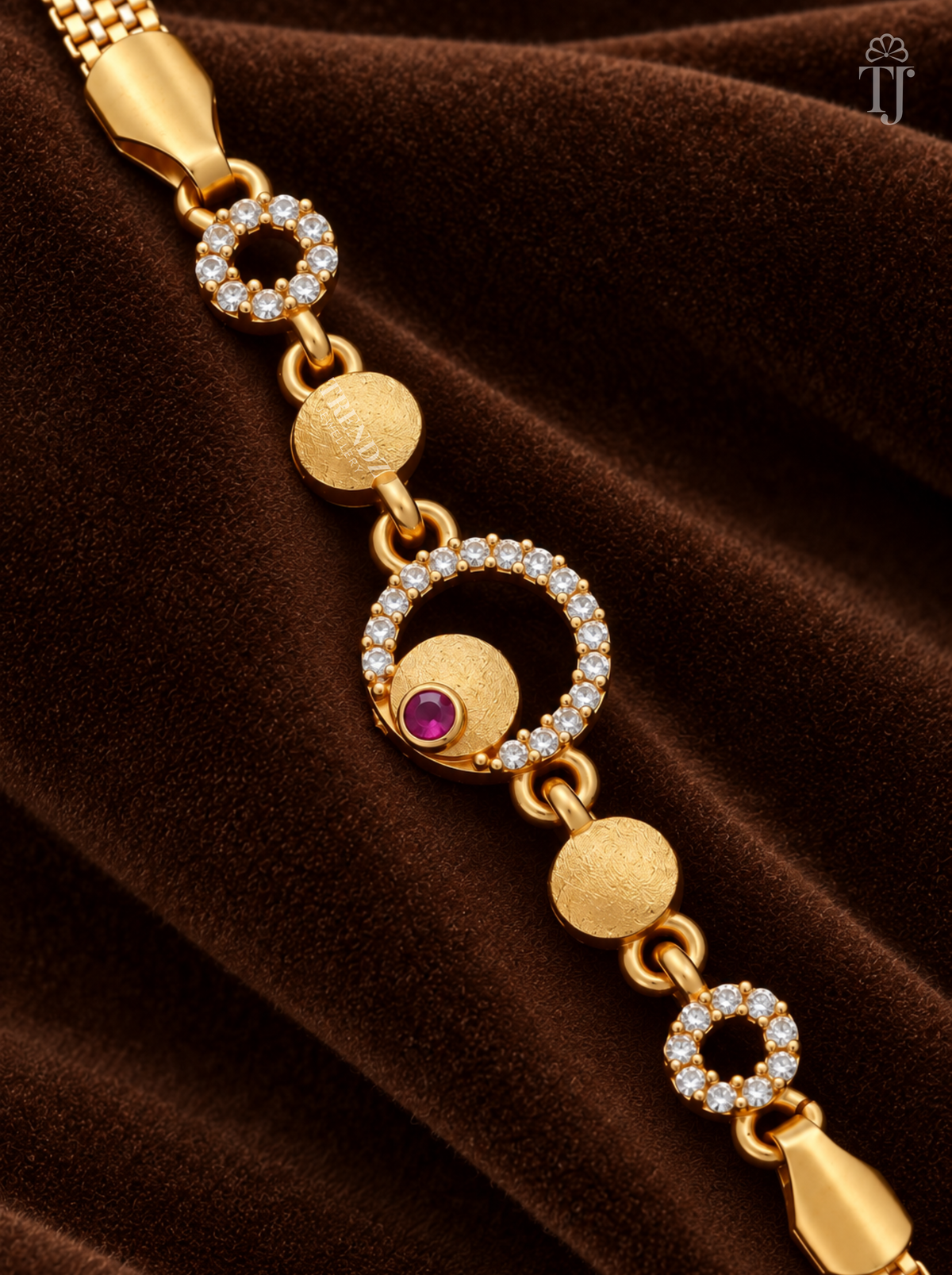 Close-up of white AD stone ring with textured gold disc and pink stone centre