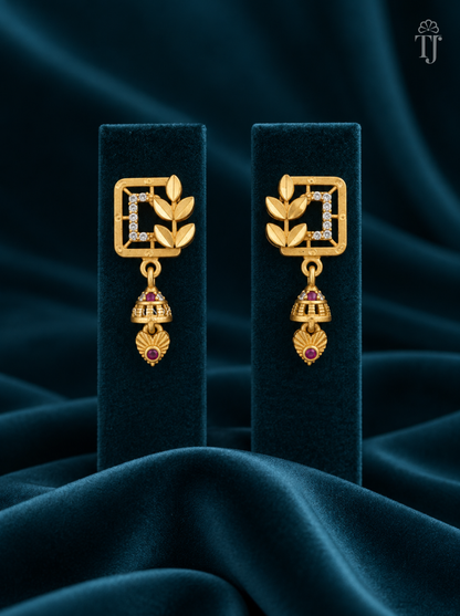 Gold plated square jhumka earrings with AD stones on teal velvet display stand