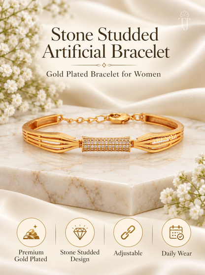 Gold-plated stone-studded adjustable bracelet displayed on a white marble slab with decorative white flowers and satin fabric. Text reads 'Stone Studded Artificial Bracelet' and 'Gold Plated Bracelet for Women,' with feature icons below.