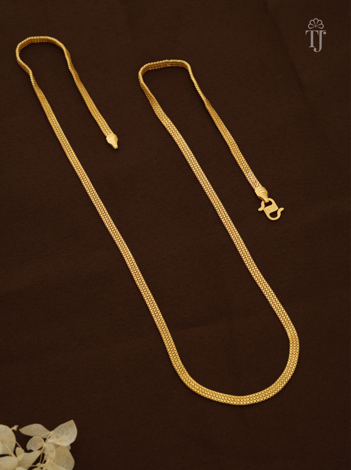 Stylish gold chain design for female with flat mesh pattern and S-hook on brown fabric
