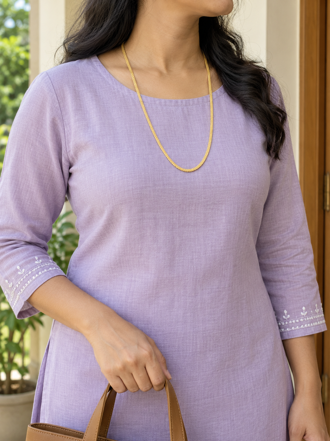 Woman in lavender kurta wearing thin gold plated box link chain, 55 cm long