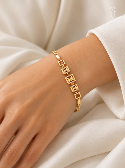 Woman wearing gold plated designer bracelet with AD diamond on wrist