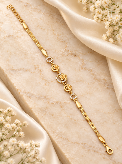 Gold plated floral round bracelet for women flat lay on cream silk