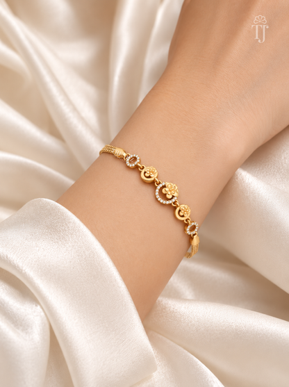 Model wearing gold plated AD diamond flower designer bracelet on wrist
