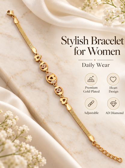 A gold-plated women's bracelet with heart and diamond motifs, styled on a cream marble surface with draped white fabric and baby's breath flowers. Text on the image reads 'Stylish Bracelet for Women' with feature icons for premium gold plating, heart design, adjustable sizing, and AD diamond.