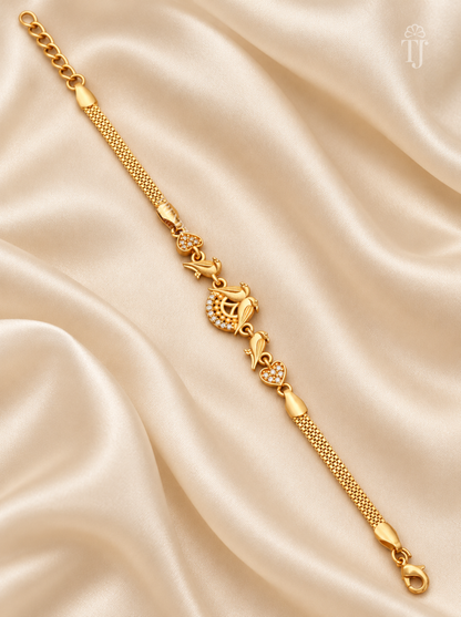 Gold plated parrot love bird designer bracelet flat lay on cream silk
