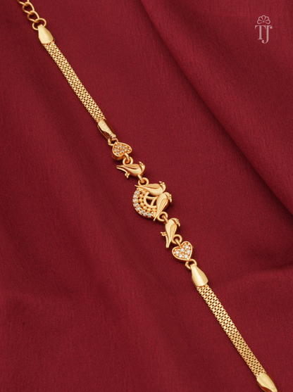 Trending parrot design gold plated bracelet for girls on red fabric