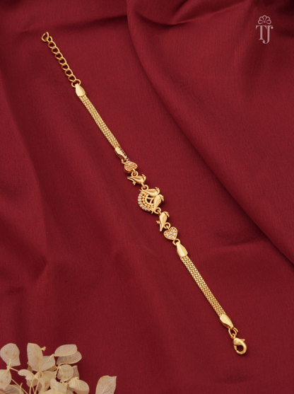 Gold plated bracelet with parrot and heart AD diamond on red cloth