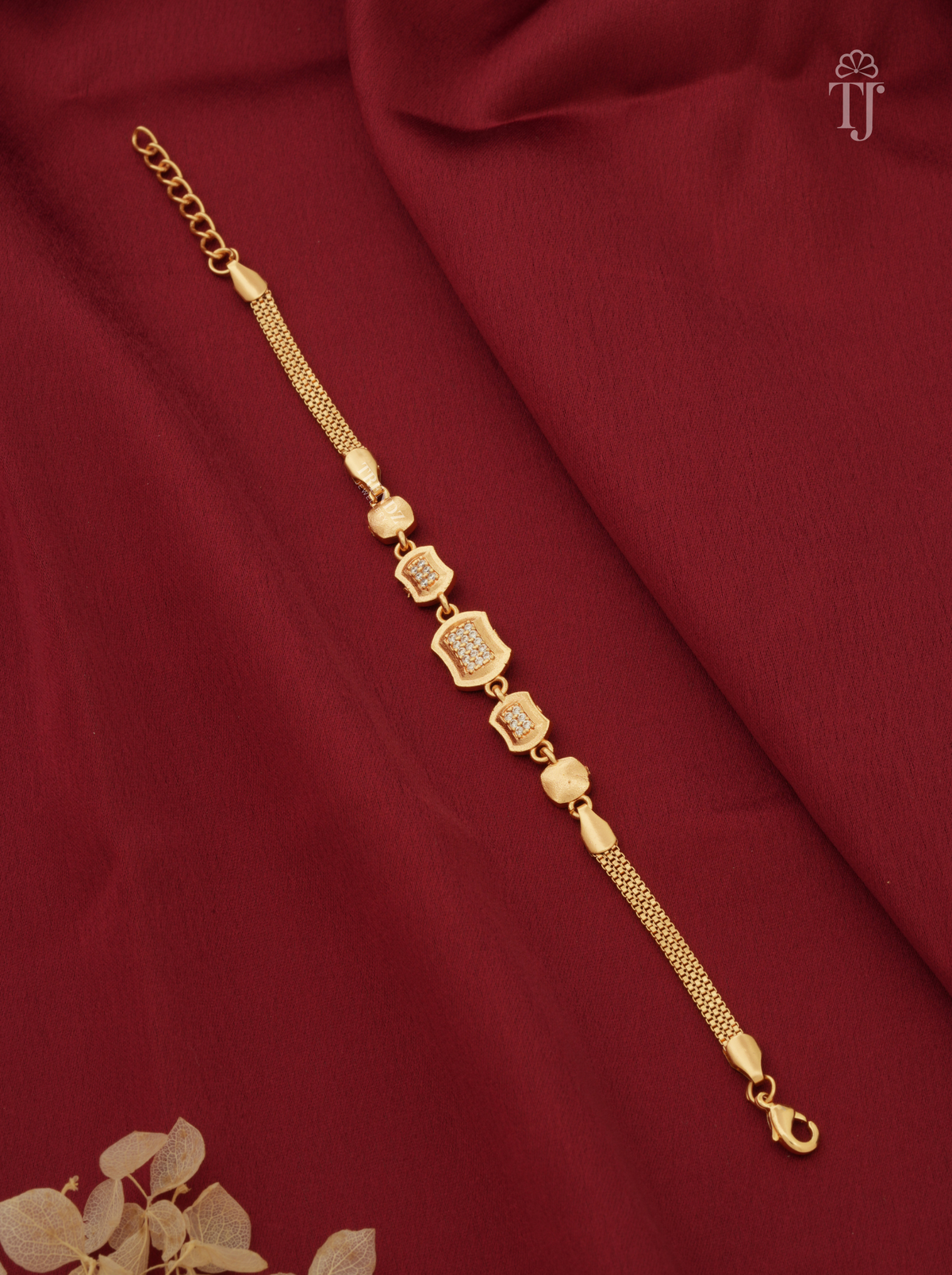 Modern geometric rectangle AD diamond gold plated bracelet for ladies on red fabric