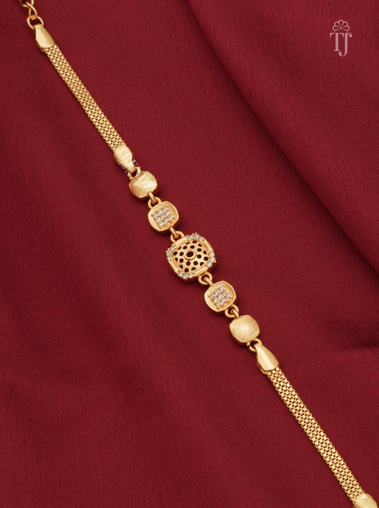 Premium gold plated square floral cutwork bracelet for girls on red fabric background
