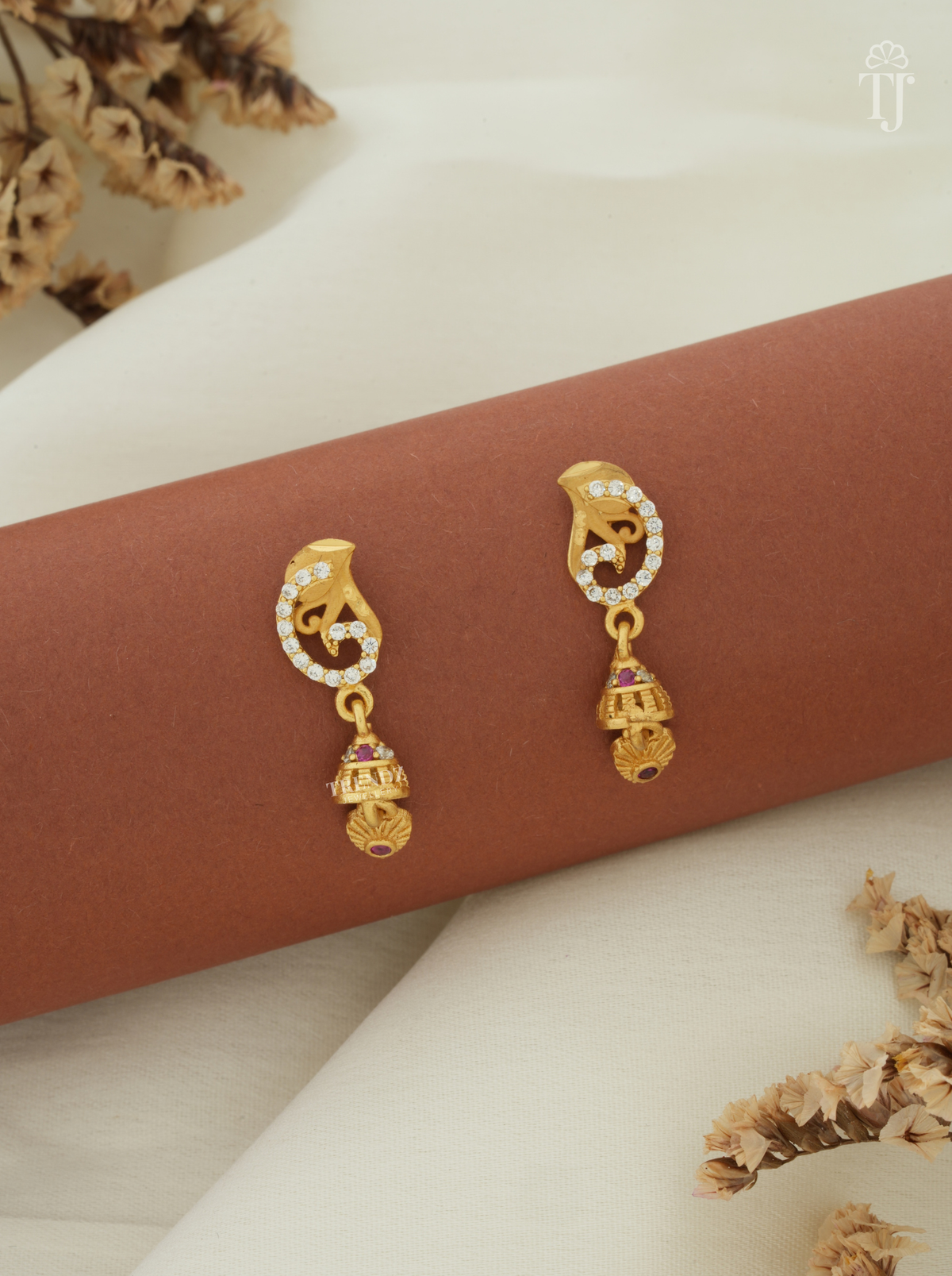 Women’s gold plated earring online, swirl design AD stone top with small gold jhumka